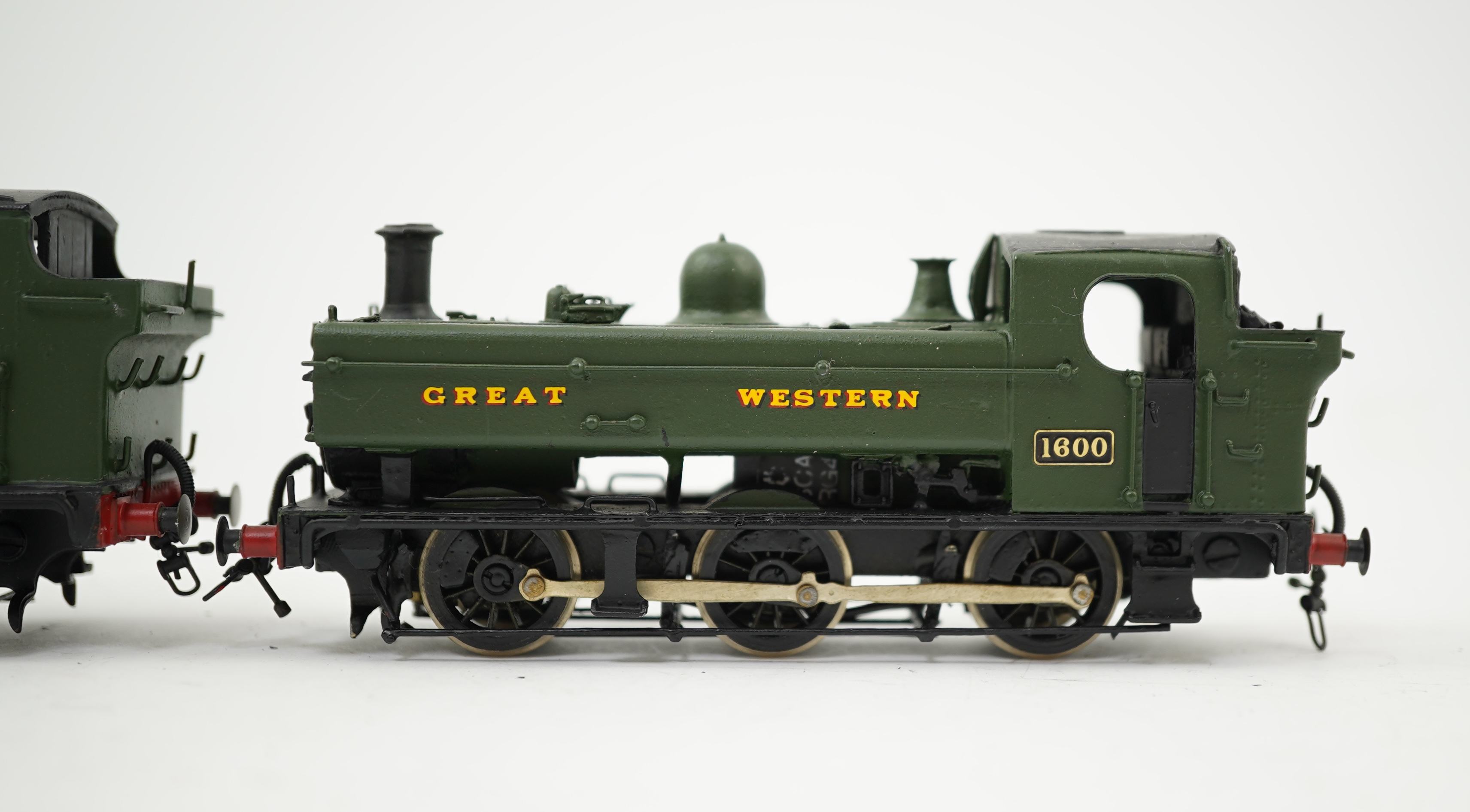 Two 00 gauge brass and white metal kit built GWR Pannier Tank locomotives; a 1600 class 0-6-0PT, 1600, together with an 7400 class 0-6-0PT, 7404, constructed, painted and lined to a high standard, both motored for two ra